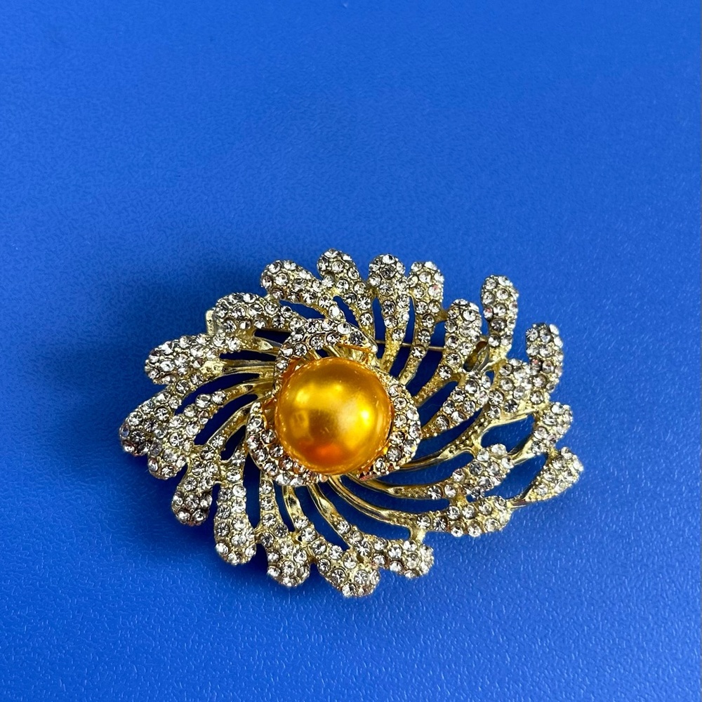 Ornate Gold and Yellow Brooch with golden pearl